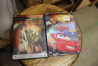 Photo of Chicago and Cars DVDs showing cover artwork and titles clearly.