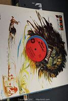 Close-up of a vinyl record with 'Pioneer Records' label and Native American themed cover art