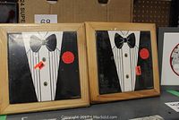Two new wall plaques approximately 7x7 inches framed in wood with tuxedo designs featuring black suits, white shirts, black bow ties, and red rose accents.