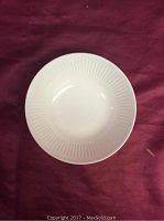 Top view of one white Athena pattern cereal/soup bowl showing ribbed texture inside.