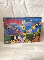 Front cover of Harrowsmith Issue Number 100 with colorful artwork featuring cards, sunflowers, hot air balloons, and a man in tuxedo including title and special anniversary text.