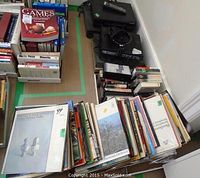 Classical vinyl records and books arranged on table, showing album covers and boxed games.