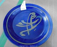 Top view of blue ceramic plate with abstract pattern