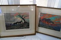 Two framed impressionist art prints by Joseph Kirkpatrick, one showing horses and a person below a tree, the other a tree-lined sunset landscape.