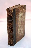 Book front cover and spine showing gilt-tooled leather binding and raised bands