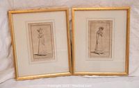 Pair of framed antique Parisian ladies costume engravings from 1817 and 1818, showing full view of both artworks with gold frames.