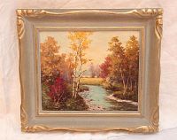 Framed oil painting of a river landscape with autumn trees, signed by William Blackwood at the bottom left.