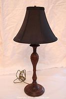 Full view of lamp with black shade showing overall condition and design.