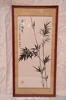 Full framed Chinese watercolor painting depicting bamboo with calligraphy and red seal stamps. Beige mat and simple brown wooden frame with glass.