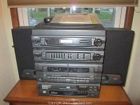 Front view of stacked Yorx L350 audio components showing tuner, equalizer, cassette decks, CD player, and side speaker visible.