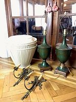 Overview of two table lamps, two sconces and four lamp shades arranged on floor