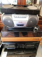 Sony black double tape player TC-WE305 at bottom of stack with dual cassette slots and control buttons