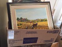 Framed signed oil painting showing rural harvest scene, men with horse and farm in background.