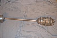 Full view of 36 inch long marine style ceiling light showing long rod, cage-protected globe, and mounting base.