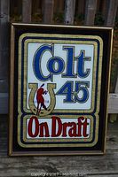 Front view of the vintage Colt .45 On Draft glass advertising sign showing the full logo and colors.
