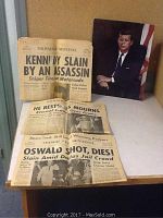 View showing three Milwaukee Sentinel newspapers from 1963 reporting on JFK's assassination, Lee Harvey Oswald's death, and public mourning, along with a color portrait of JFK.