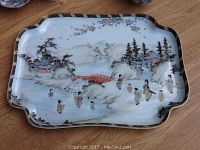 Full view of Japanese porcelain tray showing painted geisha figures, bridge, trees, and torii gate along with gold trim border.