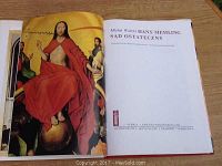 Full-page color image of a religious painting showing Christ in red robes, next to title page with text in Polish and publisher information.
