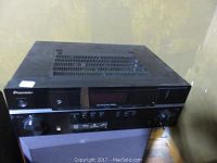 Front angle view of Pioneer SX-319V AV receiver showing top vents and control panel.