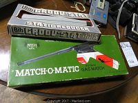 Photo of Bib Groov-Stat Static Reducer in box and Match-O-Matic Butane Gas Match in box on tabletop.