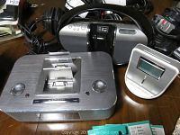 Photo showing Philips DC390 37 docking station, Philips AJ100 37 clock radio, and iLive IBR2807DP portable docking system together