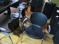 Group view of four chairs together on wood floor