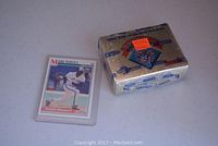 Mark Whiten rookie baseball card face visible next to unopened sealed box