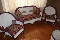 Three-piece wicker seating set arranged together