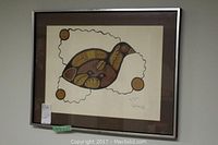 Full view of framed artwork hanging on wall