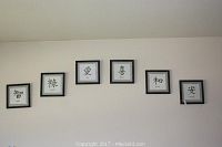 Six framed Asian-themed prints mounted on wall, showing overall set and size.