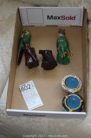 Photo shows a boxed pair of ceramic birds and two small vases for scale and condition.