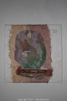 Frontal view of panel showing layered handmade paper and an abstract shape with embedded pieces.