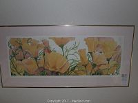 View of Gary Bukovnik floral print framed with gold-toned frame and pink mat, showing yellow and pink flowers.