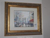 Front view of the framed art print showing Paris street scene watercolor reproduction with ornate gold and silver frame and beige matting.
