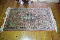 Full top view of oriental area rug showcasing the full design and colors.