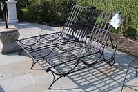 Front view of double metal lounge chair frame on patio