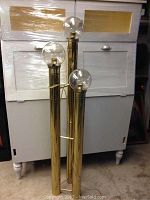 Full view of the vintage 3 tier brass floor lamp with clear glass globes, standing approximately 56 inches tall.