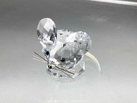 Front and slight side angle view of the Swarovski crystal mouse figurine showing the detailed face, metal whiskers, and metallic tail.