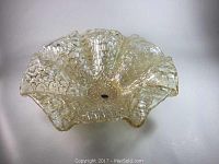 Top view of the large amber Murano glass bowl showing overall form and original label in center base.