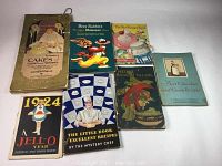 All eight vintage cook books and pamphlets arranged together showing front covers and title details.