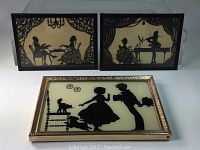 Photo showing all three framed silhouette artworks depicting courting couples on glass with intricate detailing and vintage styling.