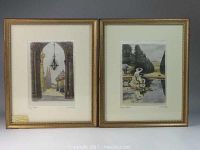 Two framed signed silk prints showing European architectural and garden scenes in gold-tone frames.