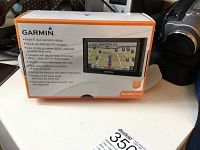 Garmin nüvi 65LM GPS navigator original box with product features displayed on front.