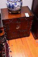Front view of entire cabinet showing two top drawers, double doors, lower drawers and decorative hardware