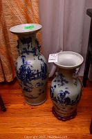 Overall view of both blue and white porcelain vases side by side