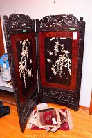 Two-panel folding screen partially folded showing overall form and decoration