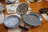 Overall shot of three decorative plates on table