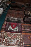 Group of six oriental style rugs and runner laid side by side