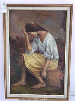 Full view of the framed oil painting showing the seated woman in natural tones