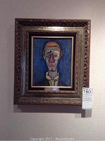 Frontal view of framed clown print titled “CLOWN Buffet” with frame and wall mounting visible